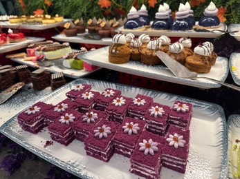 Photo of Different tasty desserts on table. Buffet service