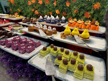 Photo of Different tasty desserts on table. Buffet service