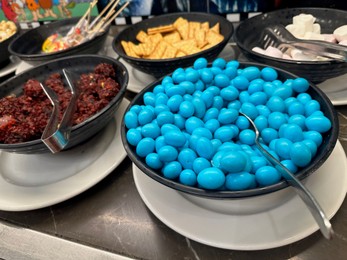 Photo of Different tasty desserts on table. Buffet service