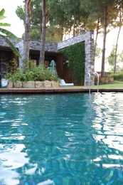 Outdoor swimming pool with clear water at luxury resort