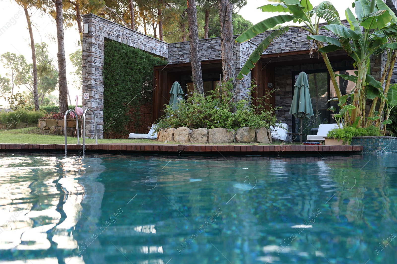 Photo of Outdoor swimming pool with clear water at luxury resort