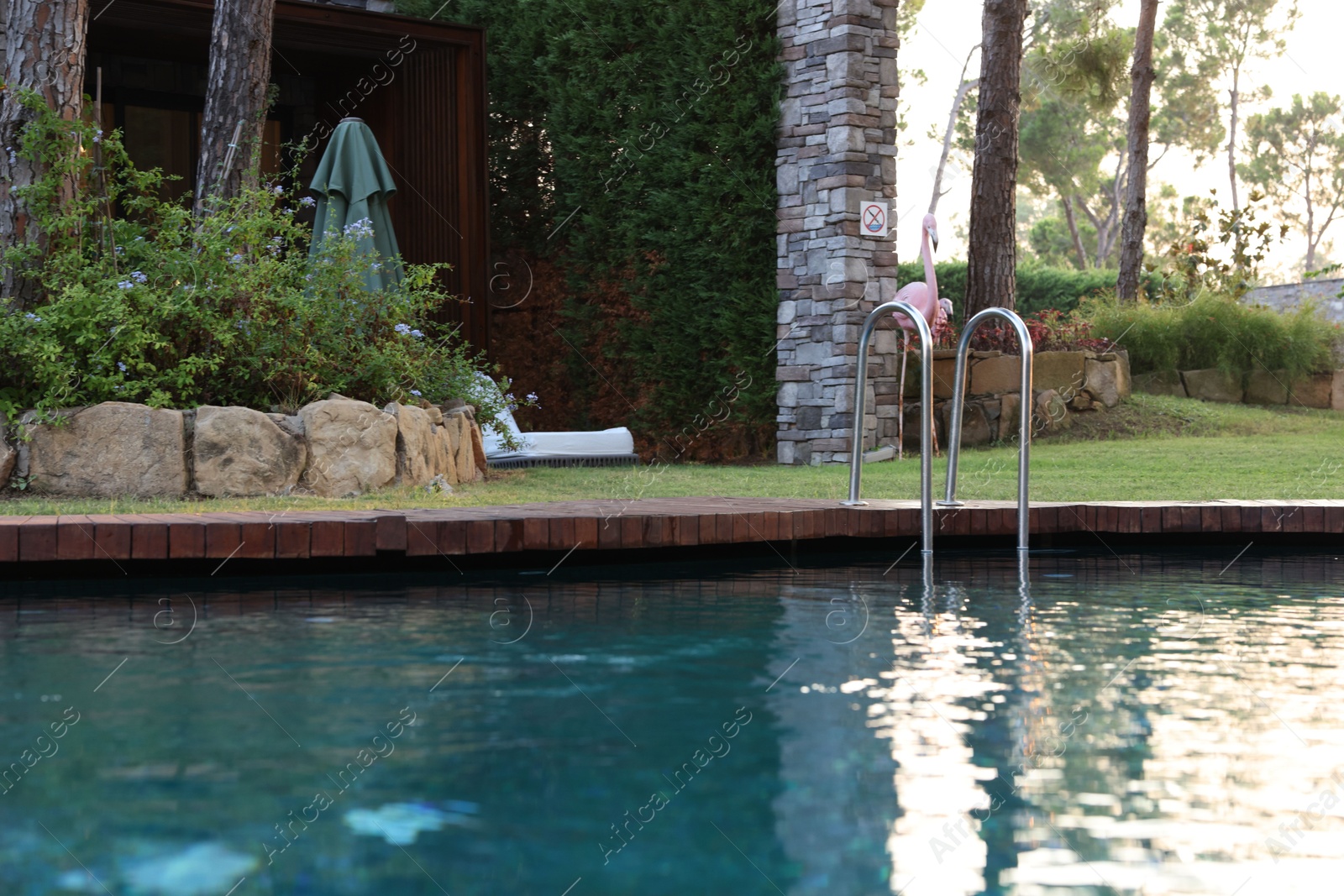 Photo of Outdoor swimming pool with clear water at luxury resort