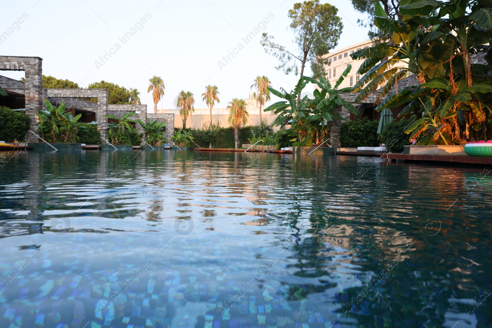 Photo of Outdoor swimming pool with clear water at luxury resort