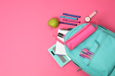 Photo of Backpack and different school supplies on pink background, flat lay. Space for text