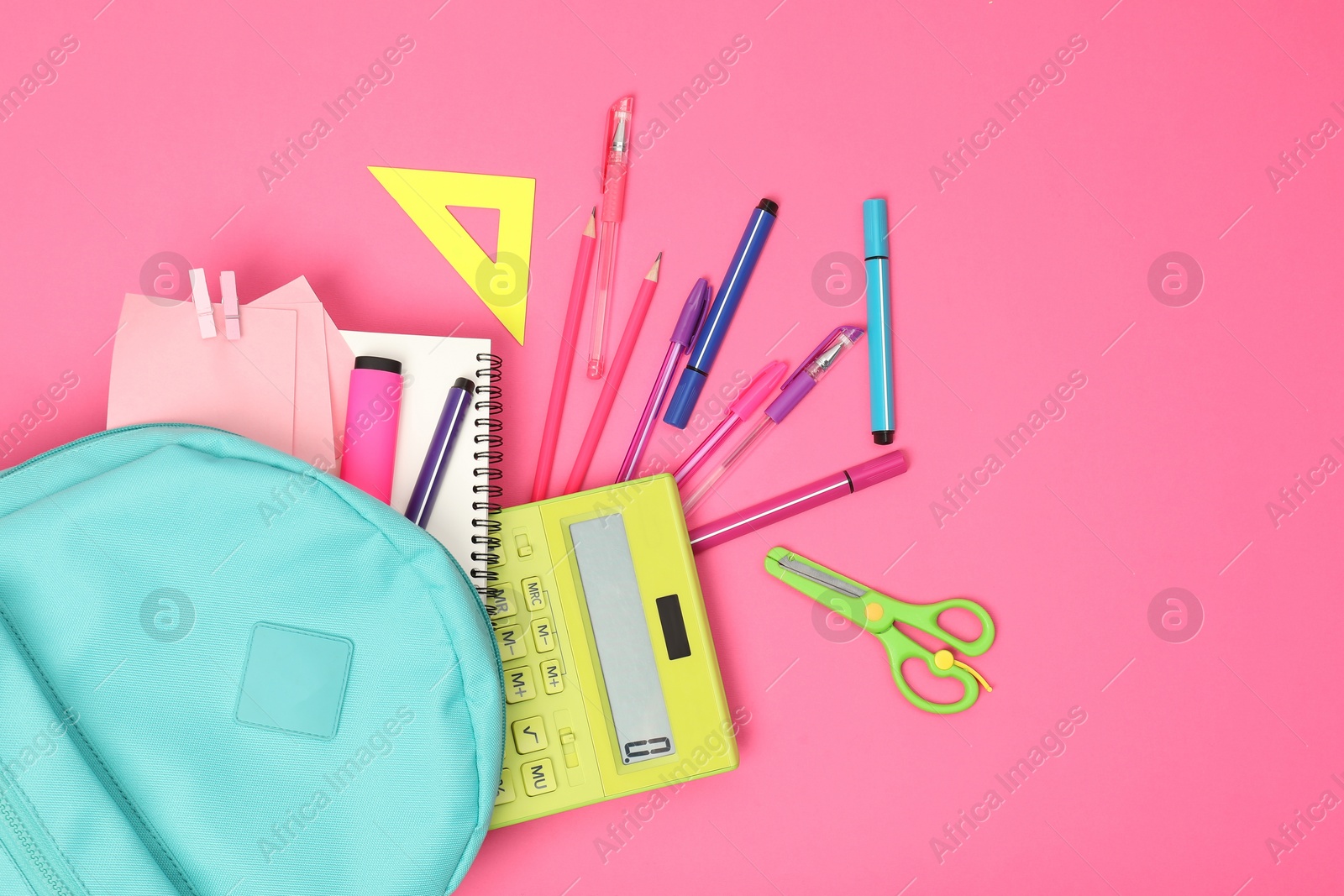 Photo of Backpack and different school supplies on pink background, flat lay. Space for text