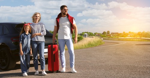 Image of Happy family near car on road trip. Banner design with space for text