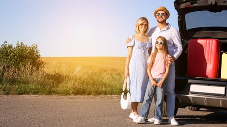 Image of Happy family near car on road trip. Banner design with space for text