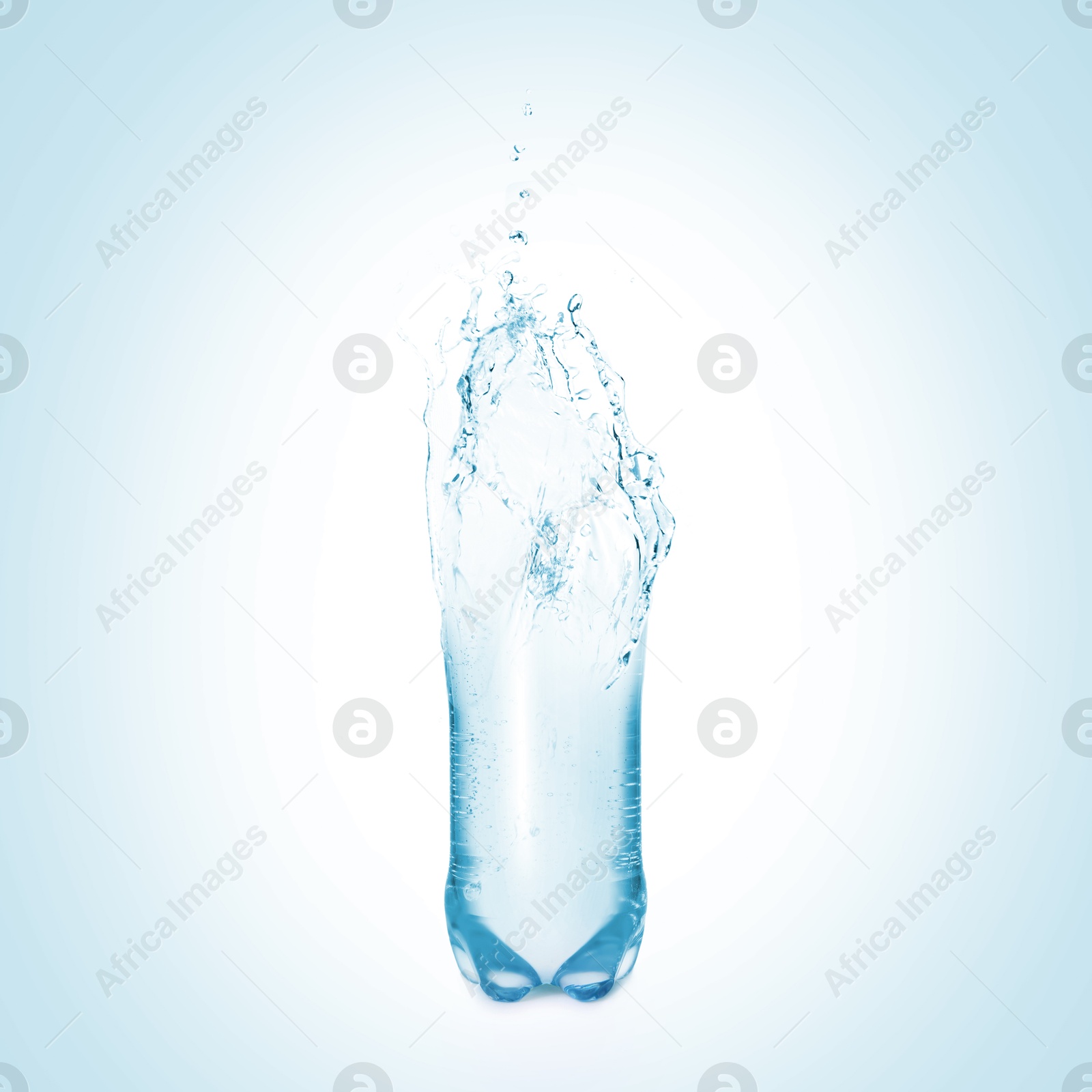 Image of Splashing water continuing shape of bottle on light blue background