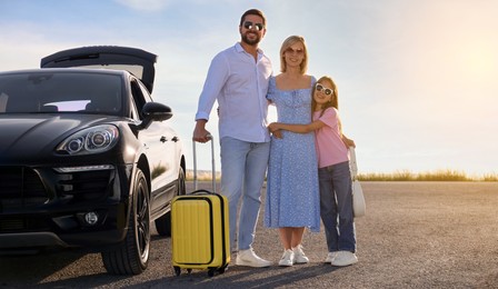 Happy family near car on road trip. Banner design with space for text