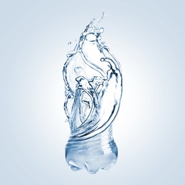 Image of Splashing water continuing shape of bottle on light blue background