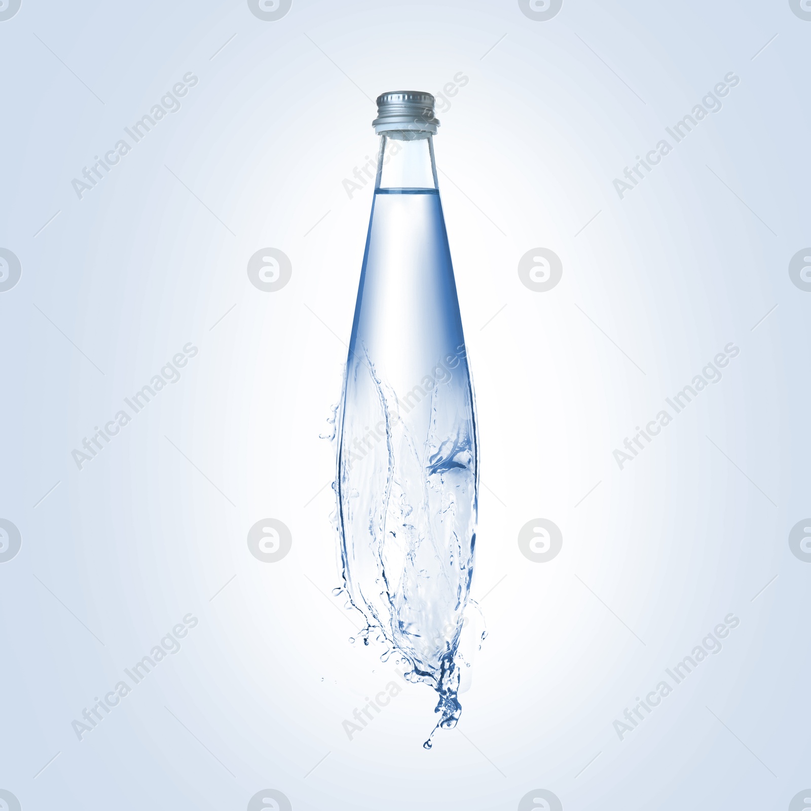 Image of Splashing water continuing shape of bottle on light blue background