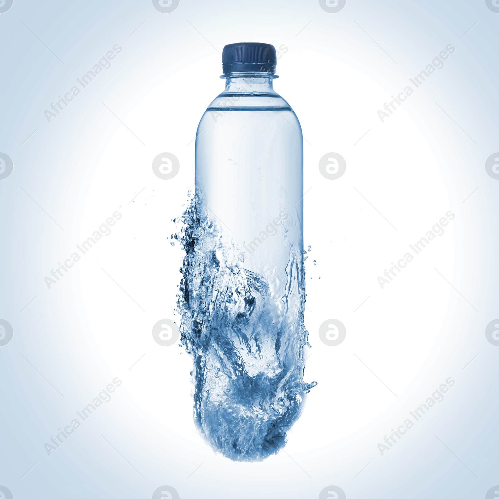 Image of Splashing water continuing shape of bottle on light blue background