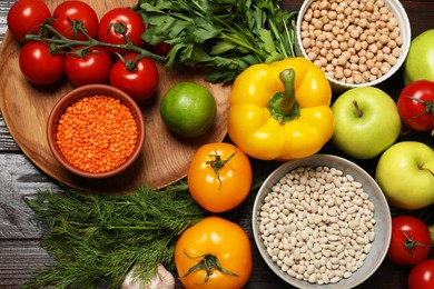 Different vegetarian products on wooden table, top view