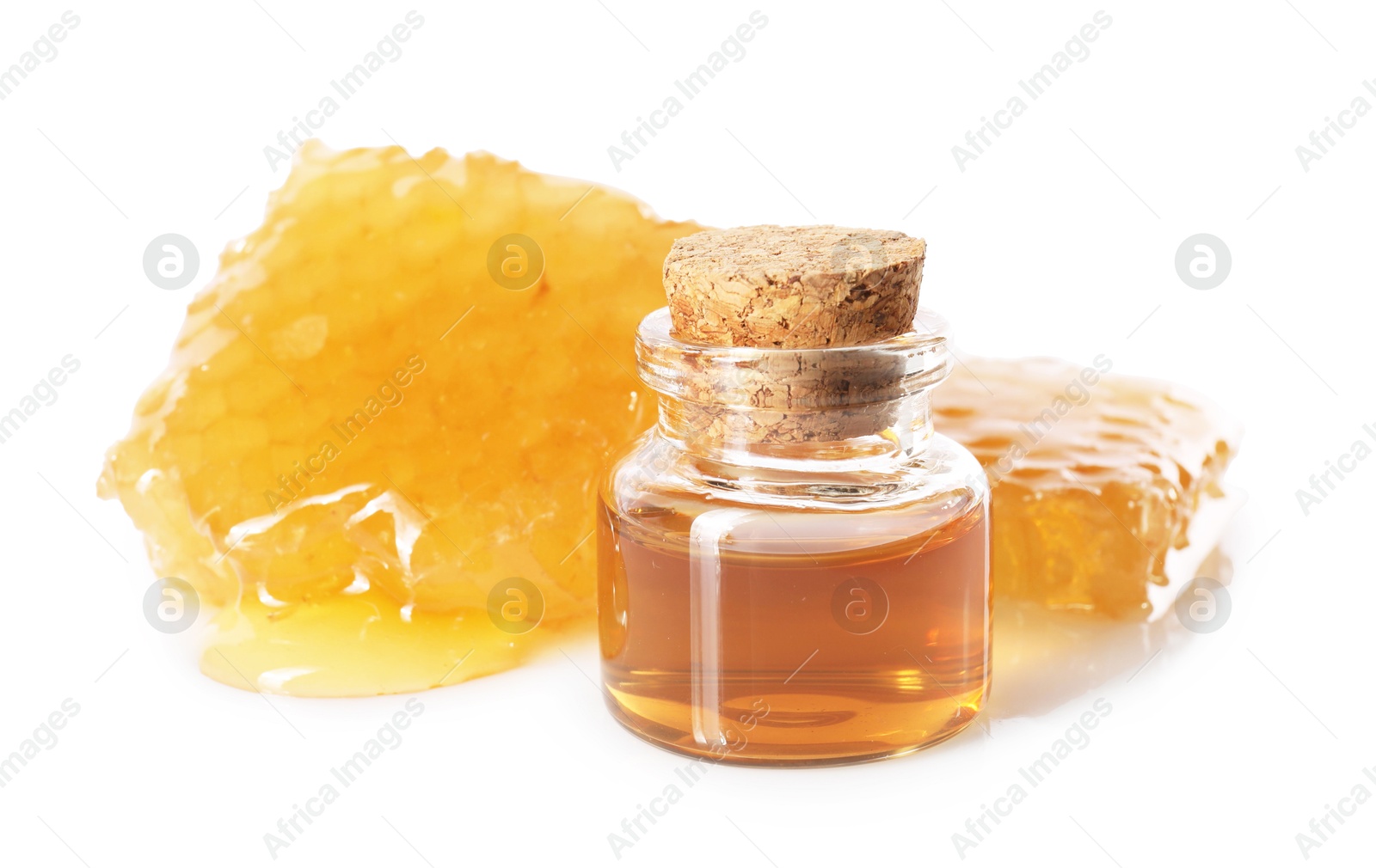 Photo of Natural honey tincture and sweet honeycombs isolated on white