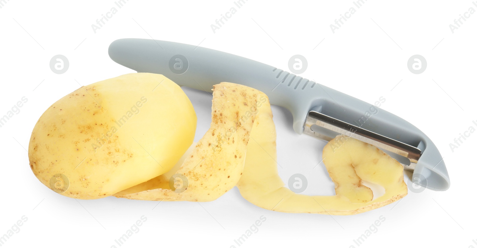 Photo of Young potato, peel and peeler isolated on white