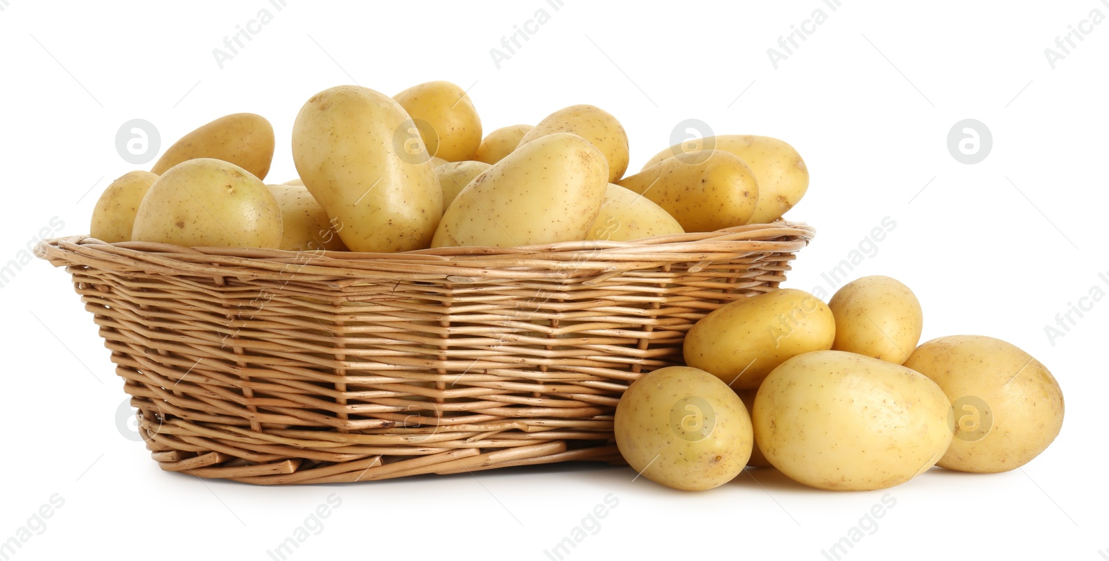 Photo of Young potatoes in wicker basket isolated on white