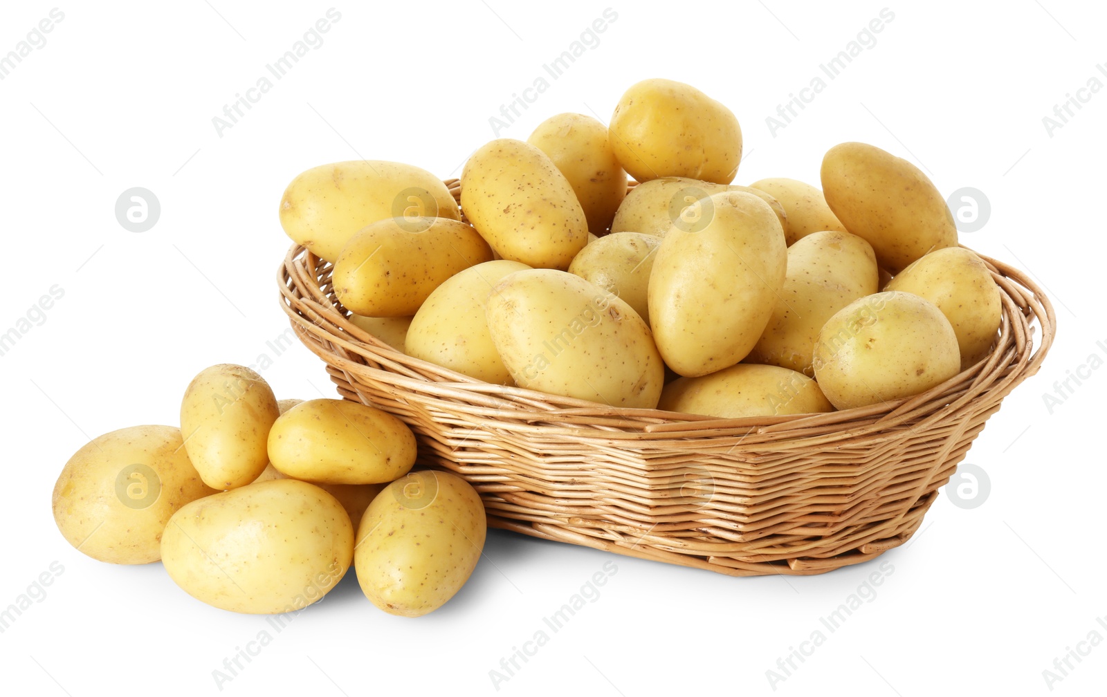 Photo of Young potatoes in wicker basket isolated on white