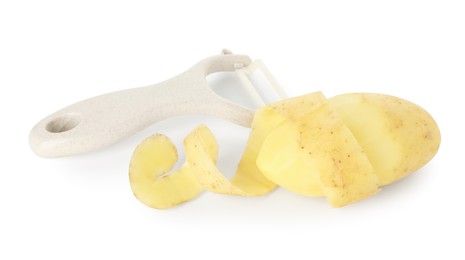 Photo of Young potato, peel and peeler isolated on white