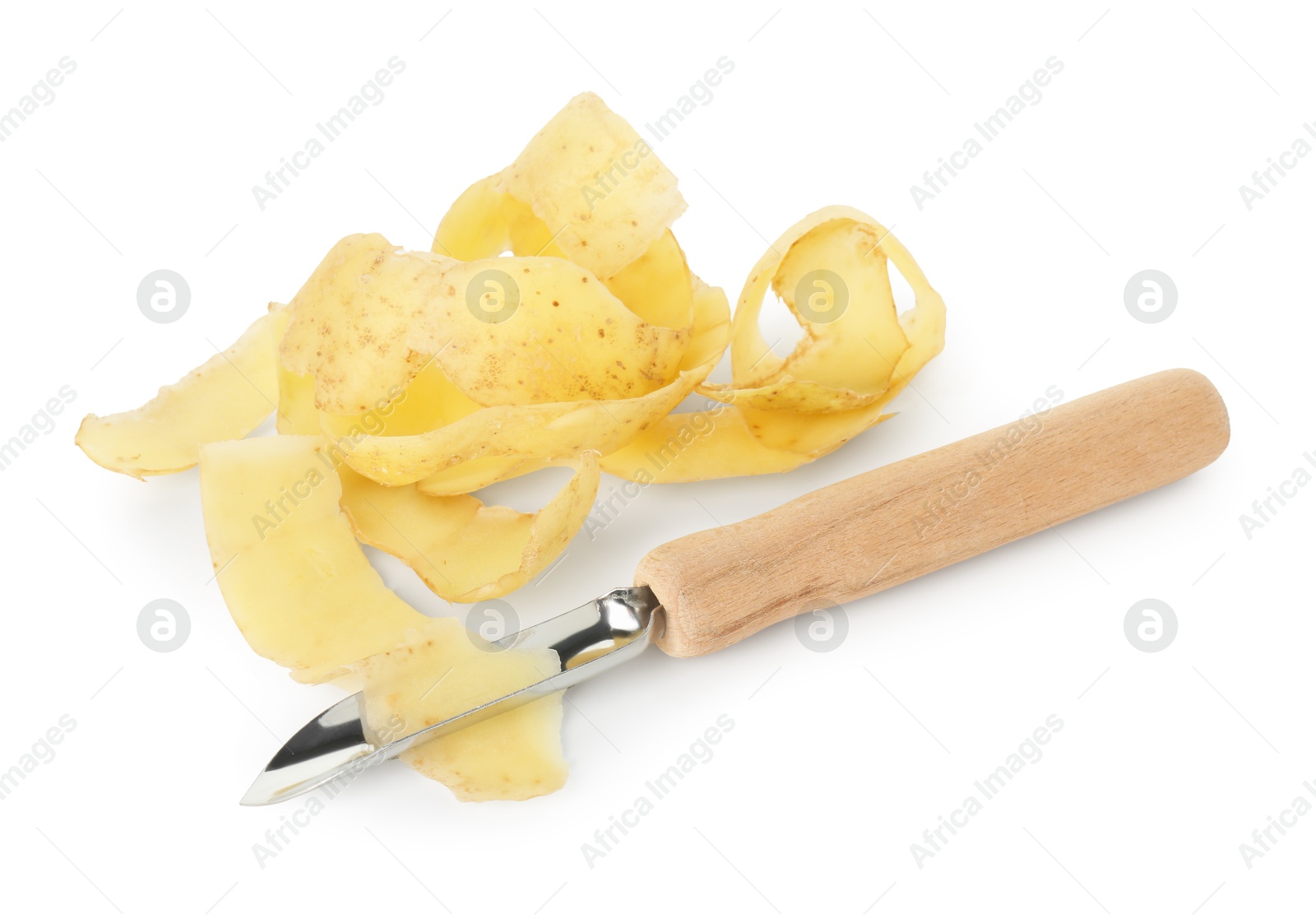 Photo of Peels of fresh young potato and peeler isolated on white