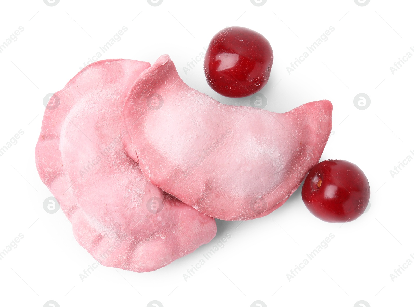 Photo of Frozen dumplings (varenyky) and fresh cherries isolated on white. Ukrainian cuisine