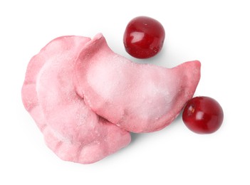 Frozen dumplings (varenyky) and fresh cherries isolated on white. Ukrainian cuisine