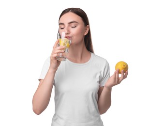 Woman drinking water with lemon on white background