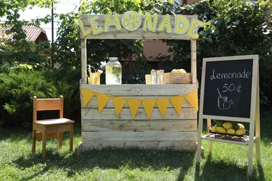 Photo of Lemonade stand with refreshing drink in park