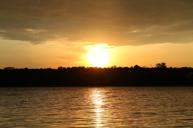 Photo of Picturesque view of beautiful sunset over lake