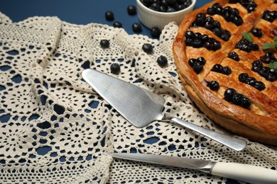 Photo of Tasty homemade pie with blueberries and mint served on table