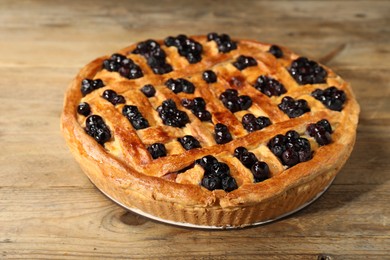 Tasty homemade pie with blueberries on wooden table, closeup