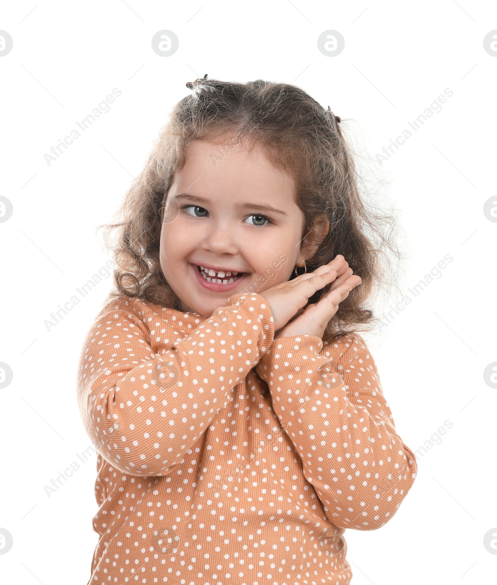 Photo of Portrait of smiling girl on white background. Adorable child