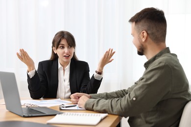 Photo of Consultant working with partner at table in office. Business meeting