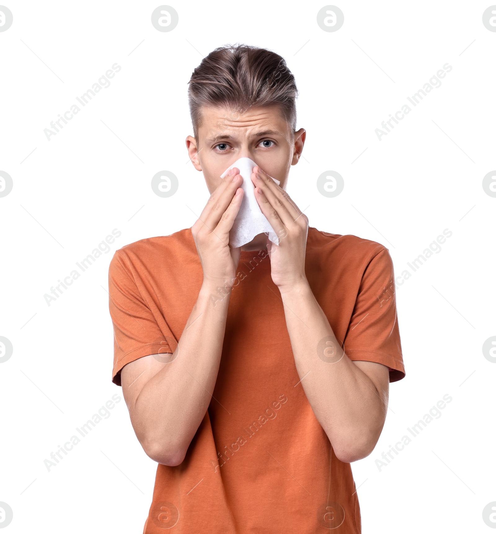 Photo of Young man with tissue suffering from sinusitis on white background