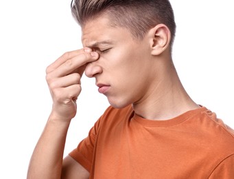 Young man suffering from sinusitis on white background