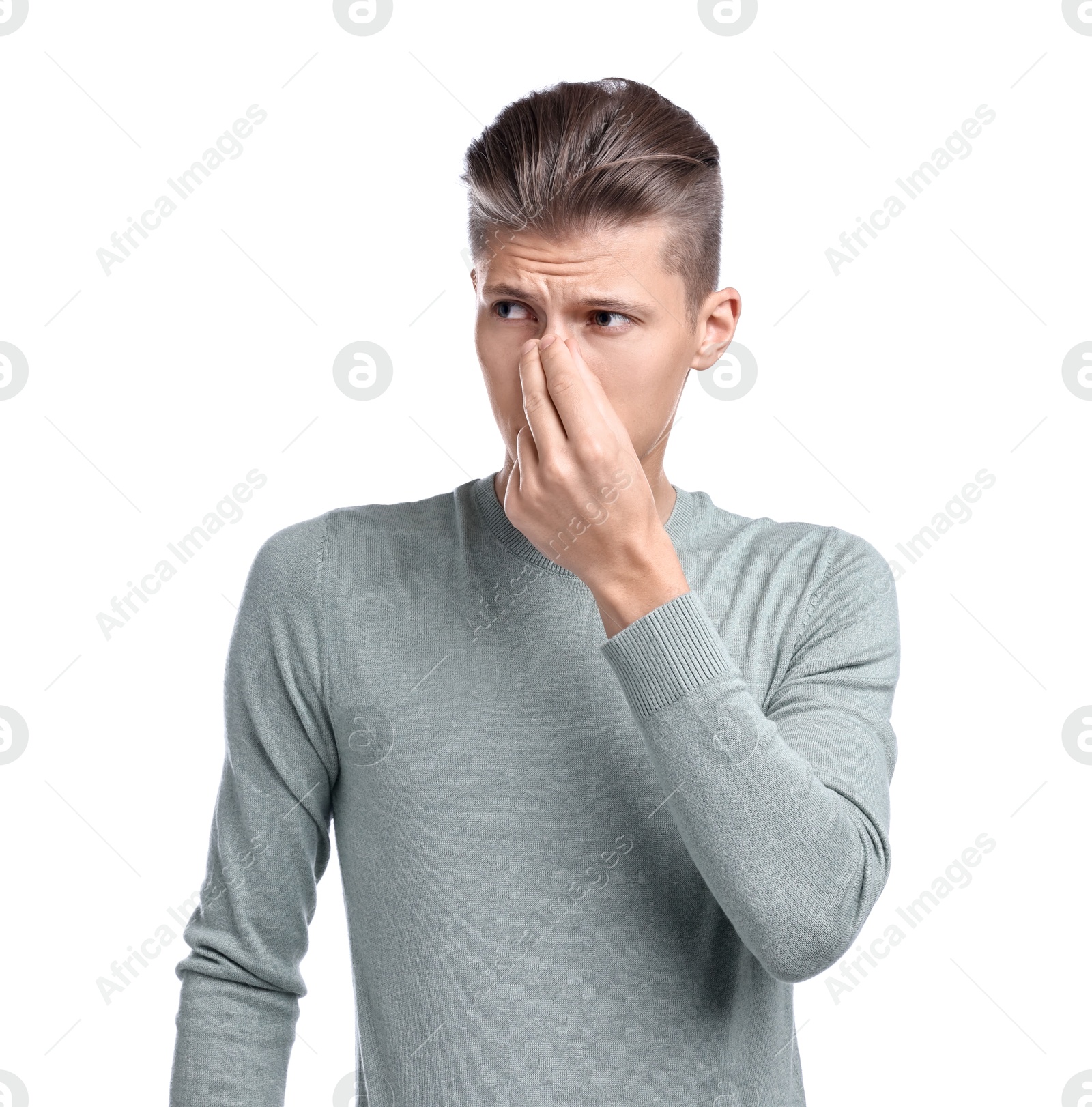 Photo of Young man suffering from sinusitis on white background