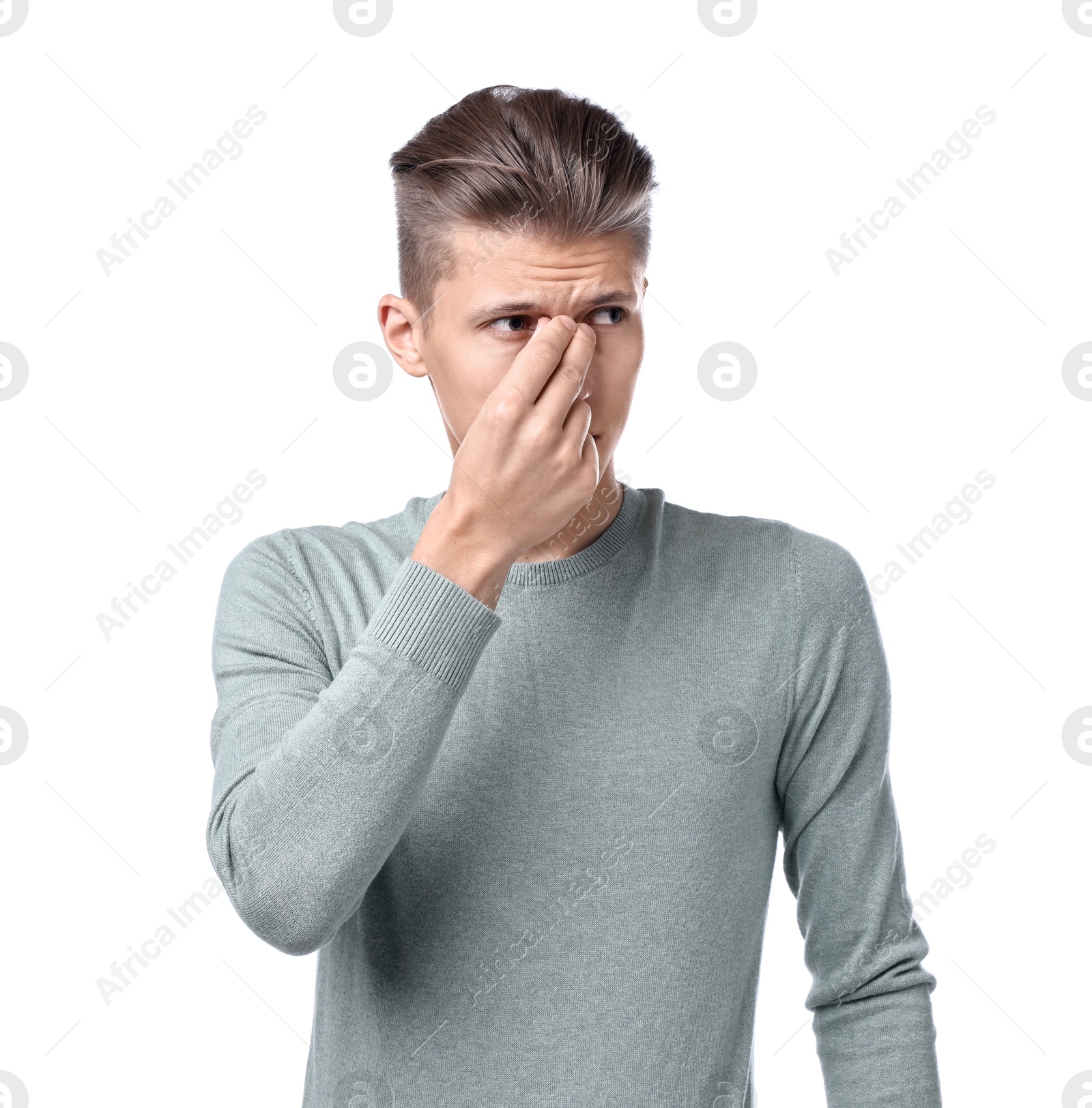 Photo of Young man suffering from sinusitis on white background