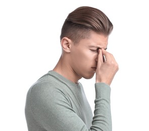 Young man suffering from sinusitis on white background