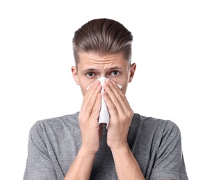 Photo of Young man with tissue suffering from sinusitis on white background