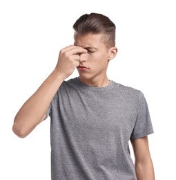 Young man suffering from sinusitis on white background