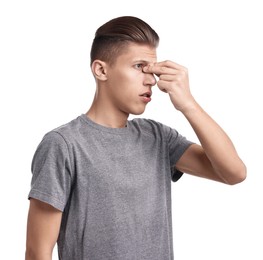 Young man suffering from sinusitis on white background