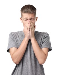 Young man suffering from sinusitis on white background