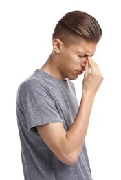 Young man suffering from sinusitis on white background