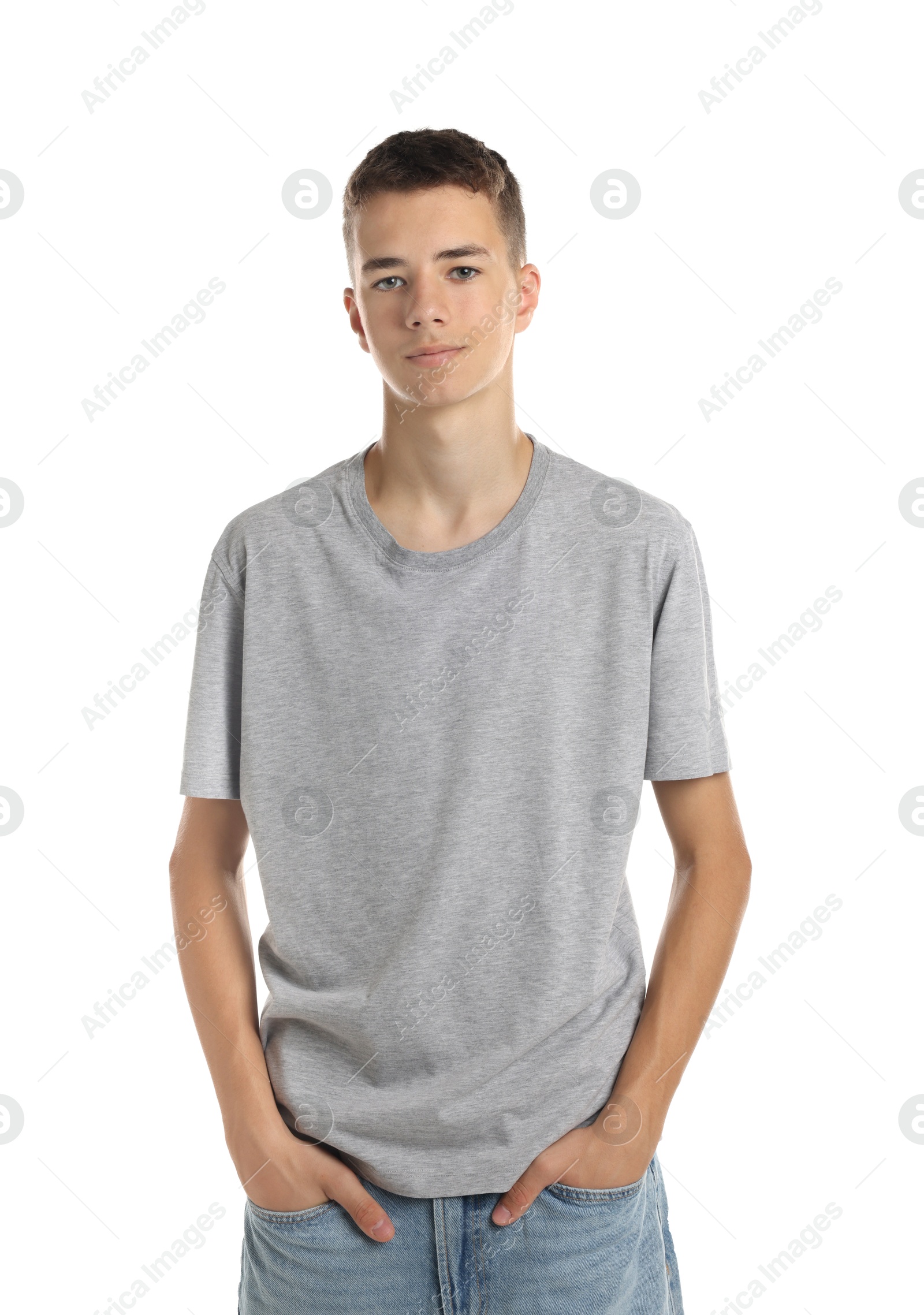 Photo of Teenage boy wearing grey t-shirt on white background