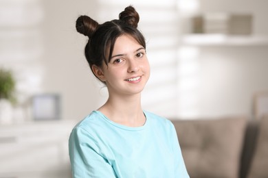 Photo of Portrait of smiling teenage girl at home