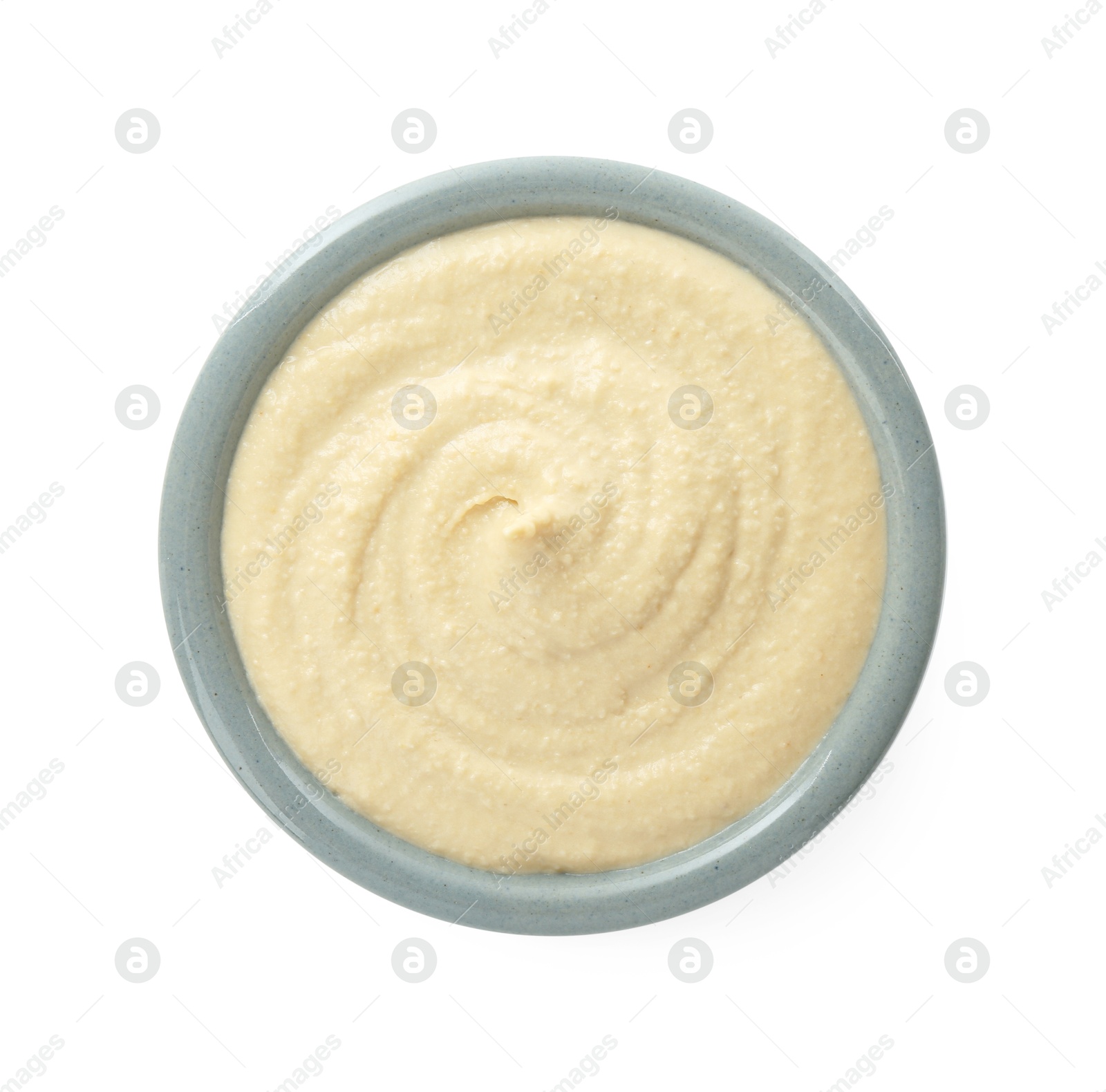 Photo of Delicious hummus in bowl isolated on white, top view