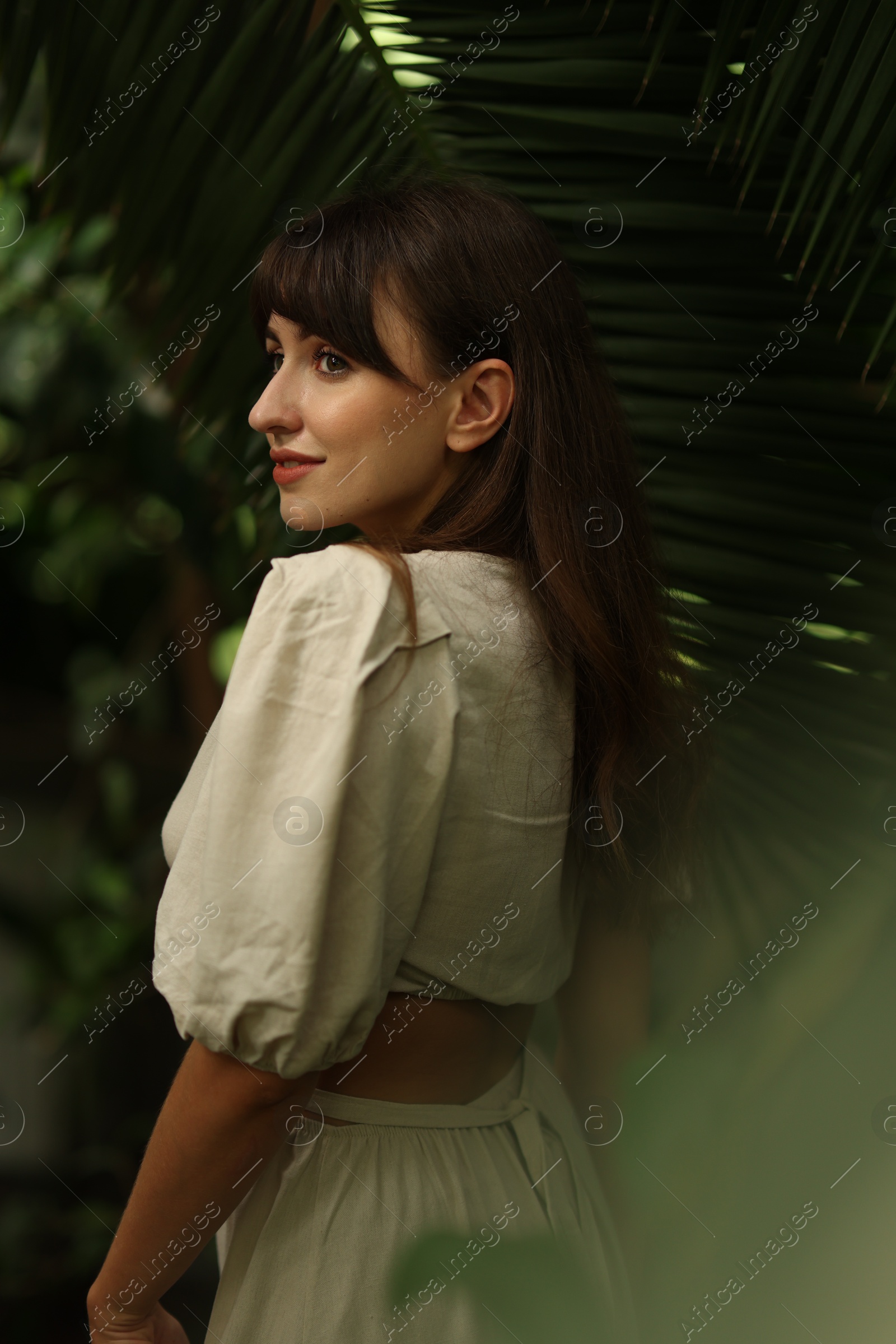 Photo of Portrait of beautiful woman in tropical forest