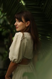 Photo of Portrait of beautiful woman in tropical forest