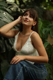 Photo of Portrait of beautiful woman in tropical forest