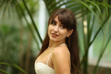 Portrait of smiling woman in tropical forest