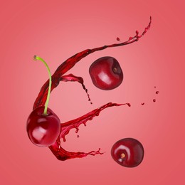 Image of Juice splashes and fresh cherries in air on red background